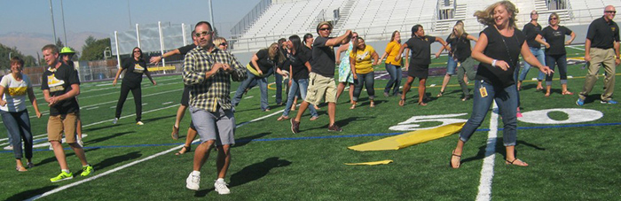 Pioneer students and faculty try out the new Apple Bowl turf. 